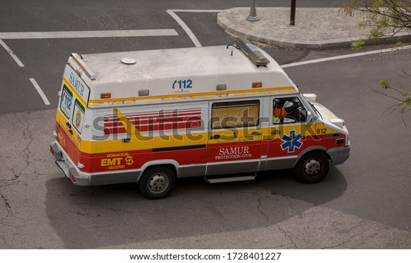 Madrid, Spain - 05 07 2020: In full\
confinement due to the Covid 19 crisis, only civil protection and\
emergency vehicles are seen on the streets of\
Madrid