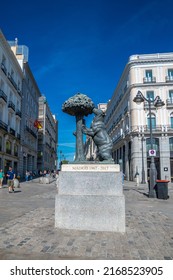 Madrid, Spain - 05.20.2022: A bear climbing a strawberry tree. An unusual, funny symbol of Madrid. Popular meeting point and landmark. Spanish zero meridian. A characteristic 4 meter high sculpture.