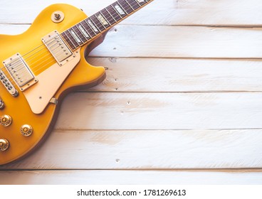 Madrid, Spain; 07 21 2020: Classic golden electric guitar model "Gibson Les Paul Gold Top" on a white wooden table.