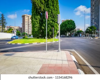 Madrid, Madrid / Spain - 08 11 2017: Arturo Soria Street Intersection With San Luis Street In Hortaleza Neighborhood, District In Madrid, Spain. Green Island With Trees, Roundabout / Traffic Circle.