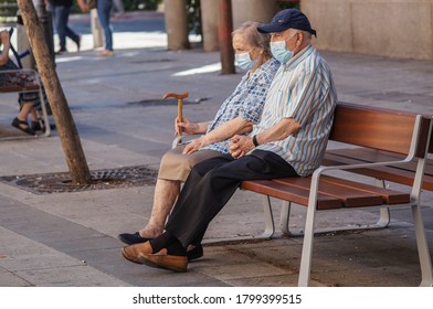 Madrid, Spain / 08 19 20: Coronavirus Crisis In Madrid. Retired Couple On A Bench.