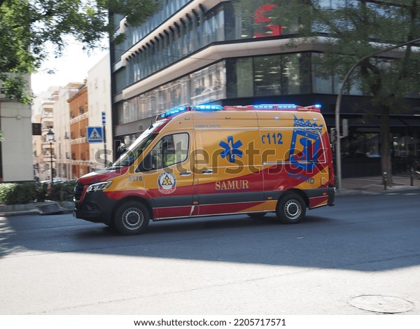 Madrid, Spain. 09-22-2022. An ambulance with\
emergency lights goes to the\
hospital