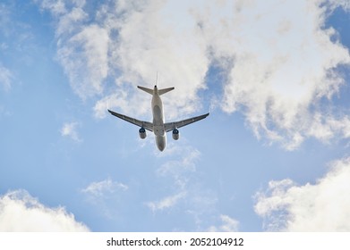 Madrid, Spain; 09-25-2021: Airbus A320 Plane Of Lufthansa Airline Viewed From A Low Angle And From Behind Just After Take Off In A Blue Sky