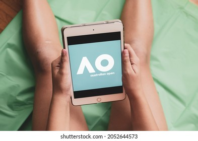 Madrid, Spain. 10-02-2021: Hands Of A Child Holding An Ipad Tablet With The Australian Open  Logo On The Screen.