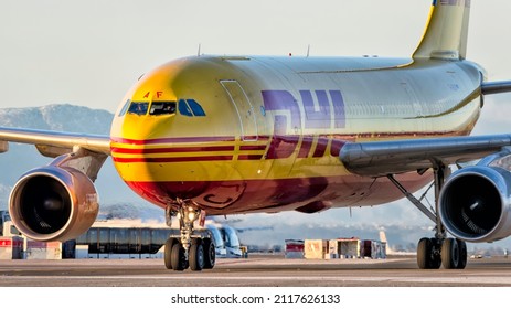 MADRID, SPAIN 20 JAN 2018. An Airbus plane of the DHL cargo airline taxiing at the Adolfo Suárez Madrid Barajas airport at sunset