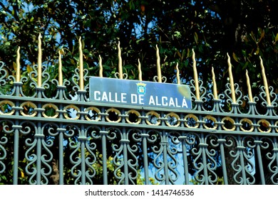 Madrid / Spain - 21 May 2019: Calle De Alcalá Street Sign On A Grated Fence Across From The Plaza De Cibeles In Downtown Madrid. 