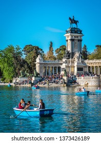 Madrid, Spain - April 2019: People Enjoy Spring Evening In Retiro Park