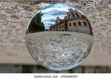 Madrid, Spain- April 30, 2021: Reflection In A Glass Ball Of The Slaughterhouse Building In Madrid.  Livestock Buildings.  Madrid Slaughterhouse