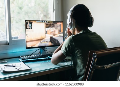 Madrid, Spain - August 15, 2018: Teenager Playing Counter Strike Global Offensive Video Game On PC. CSGO Is An Online Multiplayer Video Game Developed By Valve