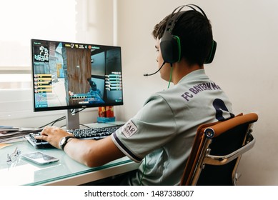 Madrid, Spain - August 23, 2019: Teenager Playing Counter Strike Global Offensive Video Game On PC. CSGO Is An Online Multiplayer Video Game Developed By Valve