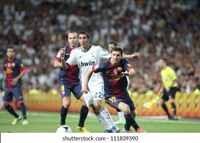 MADRID, SPAIN - AUGUST 29: Leo Messi Fights For The Ball With Angel Di Maria During The Supercopa, Real Madrid Vs FC Barcelona, On August 29, 2012 At The Santiago Bernabeu Stadium.