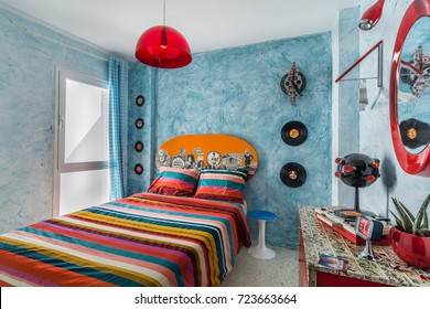 Madrid, Spain. Circa September 2017. Vintage Bedroom With A 60s Clock, Desk, Records,mirror, Colorful Bedcover And Retro Lamp