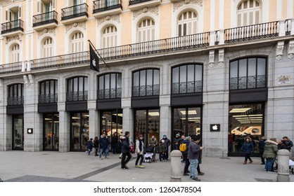 Madrid, Spain - December 2018: Apple Store In Puerta Del Sol,downtown And The City Center Of Madrid, With Pedestrians Passing By Outside The Store.