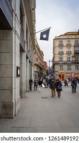 Madrid, Spain - December 2018: Apple Store In Puerta Del Sol,downtown And The City Center Of Madrid, With Pedestrians Passing By Outside The Store.