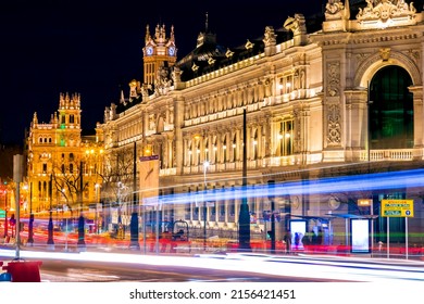 Madrid, Spain - FEB 17, 2022: Night view in long exposure on the Calle de Alcala, Madrid. Historical buildings, palaces, hotels and the cars in motion.
