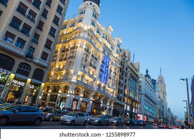 Madrid, Spain - Jan 24, 2016: Trafic On Gran Via Street, Main Shopping Street Of Madrid At Dusk On January The 24th In Madrid, Spain.