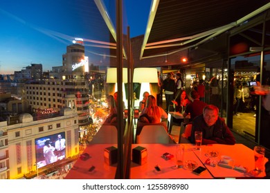 Madrid, Spain - Jan 24, 2016: People Enjoying Evening Drinks And Amazing Panoramic Views Of Madrid At Dusk On Rooftop Bar Of El Corte Ingles Department Store On January The 24th In Madrid, Spain.