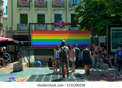 MADRID, SPAIN - JULY 7, 2018: Metro Station Adorned With A Rainbow Flag The Gay Pride Party Day