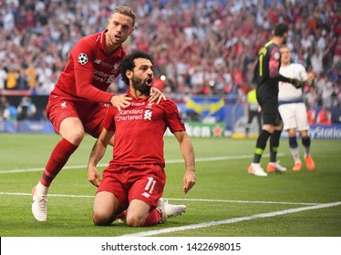 MADRID, SPAIN - JUNE 1, 2019: Mohamed Salah of Liverpool celebrates with Jordan Henderson of Liverpool after he scored from the penalty spot during the 2018/19 UEFA Champions League.
