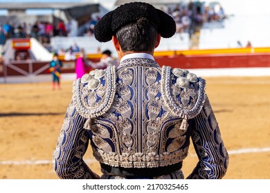 Madrid, Spain- June 19, 2022: Bullfight in the town of Villarejo de Salvanés. Bullfighter with jacket and montera with his back to the camera.