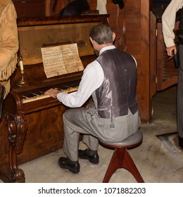 MADRID, SPAIN - MAR 28, 2018: Piano Player In Saloon, Cinema Area, Wax Museum In Madrid