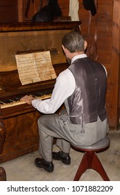 MADRID, SPAIN - MAR 28, 2018: Piano Player In Saloon, Cinema Area, Wax Museum In Madrid