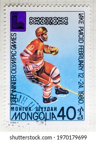 MADRID, SPAIN - MARCH 10, 2021. Vintage Stamp Printed In Mongolia Shows Ice Hockey For Winter Olympics 1980, Lake Placid (USA)