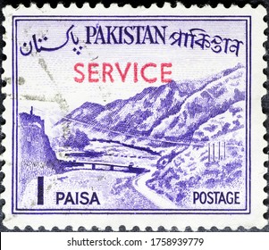 MADRID, SPAIN - MARCH 15, 2020. Vintage stamp printed in Pakistan shows Khyber Pass, a mountain pass in the Khyber Pakhtunkhwa province of Pakistan, on the border with Afghanistan