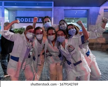 MADRID, SPAIN - MARCH 21 2020. A group of healthcare workers fighting coronavirus gather outside the Fundación Jiménez Díaz hospital, in Madrid, and draw muscle as a sign of optimism.