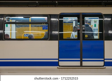 MADRID, SPAIN - MARCH 23, 2019: People Inside Subway Train In Madrid, Train Door Is Closed. Subway Train Crowded With People Waiting To Leave At Delicias Subway Station.