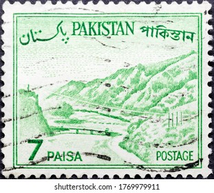 MADRID, SPAIN - MARCH 6, 2020. Vintage stamp printed in Pakistan shows The Khyber Pass, a mountain pass in the Khyber Pakhtunkhwa province of Pakistan, on the border with Afghanistan