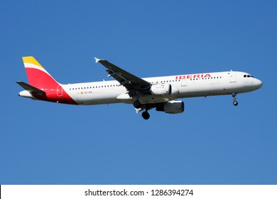 MADRID / SPAIN - MAY 1, 2016: Iberia Airlines Airbus A321 EC-HUI passenger plane landing at Madrid Barajas Airport