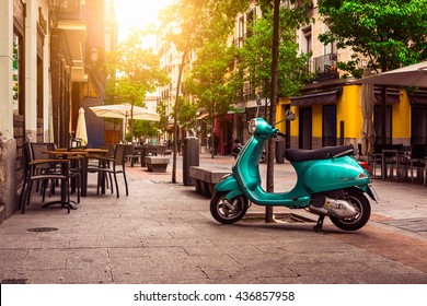 Madrid, Spain - May 10, 2016: Scooter Vespa parked on old street in Madrid, Spain