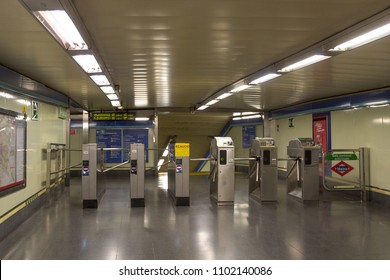 MADRID, SPAIN - MAY 15 2018: Inside the Madrid Metro subway system. Madrid underground is cheap, easy to navigate public transport for tourist and people of the city. Ticket toll barrier on entrance