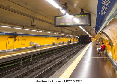 MADRID, SPAIN - MAY 15 2018: Inside the Madrid Metro subway system. Madrid underground is cheap, easy to navigate public transport for tourist and people of the city. People waiting for the train