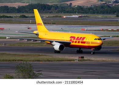 Madrid, Spain - May 4, 2016: DHL cargo plane at airport. Air freight and shipping. Aviation and aircraft. Transport industry. Global international transportation. Fly and flying.