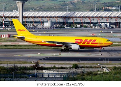 Madrid, Spain - May 4, 2016: DHL cargo plane at airport. Air freight and shipping. Aviation and aircraft. Transport industry. Global international transportation. Fly and flying.