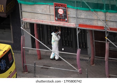 Madrid, Spain; May 5 2020: Healthcare Worker Wearing PPE Entering A Nursing Home During Covid-19 Pandemic