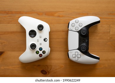 Madrid, spain - May 5 2021: Xbox series S and Playstation 5 controllers back to back