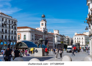 Madrid, Spain - May 8, 2021: Scenic View of Puerta del Sol Square with People during Coronavirus Covid-19 Pandemic on a sunny day. Social Distancing Concept