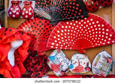 Madrid (SPAIN) November 05, 2021: Fans And Castanets, Typical Spanish Souvenirs With Flamenco Polka Dots In Red, White And Black.