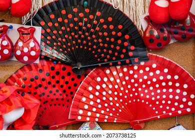 Madrid (SPAIN) November 05, 2021: Fans And Castanets, Typical Spanish Souvenirs With Flamenco Polka Dots In Red, White And Black.