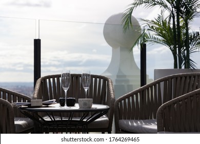 Madrid (Spain) - November 2019. Two Empty Champagne Glasses On A Table At A Rooftop Bar.