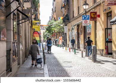 Madrid /Spain - October 15, 2019:  A Woman Carries Groceries Home In The Chueca Neighborhood, Known For Charming Streets And Traditional Architecture.