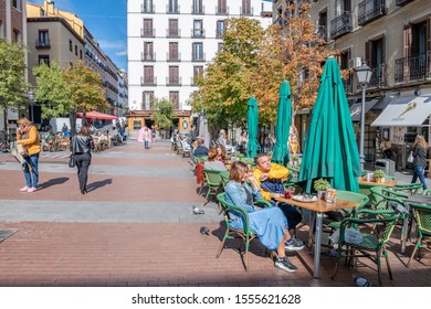 Madrid /Spain - October 15, 2019: People Enjoy Eating In The Chueca Plaza, The Center Of Social Life In The Beautiful Chueca Neighborhood.