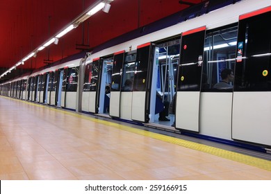 MADRID, SPAIN - OCTOBER 23, 2012: People ride Madrid Metro train. Madrid Metro has annual ridership of 634 million passengers (2011).
