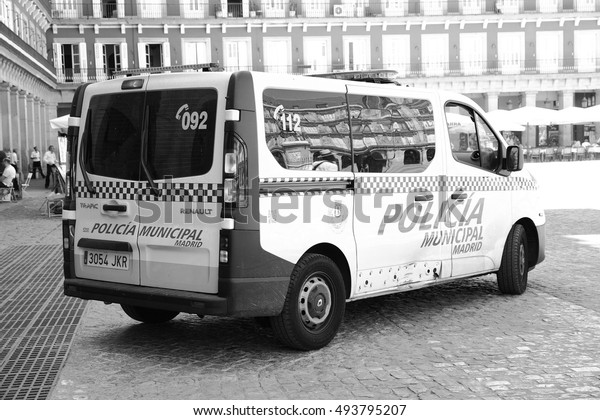 MADRID, SPAIN - September 06, 2016:\
Police car on Plaza Mayor in Madrid. Black and white\
image