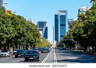 Madrid, Spain - September 12, 2021: View of Paseo de la Castellana Avenue with skyscrapers. It is the main avenue in the city. Traffic on the road a sunny day