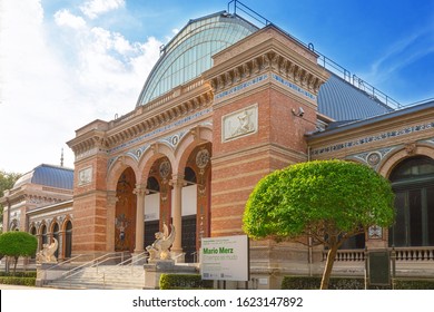 Madrid, Spain - September 19, 2019: Buen Retiro Park Is A City Park In Madrid's Retiro District.  Palace Of Velazquez (Palacio De Velázquez) - The Work Of The Architect Ricardo Velazquez Bosco. 