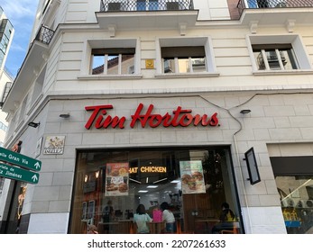 Madrid, Spain - September 24, 2022: Canadian Fast Food Restaurant Tim Hortons At Madrid City Centre Near Plaza Santo Domingo Square. Name And Logo Above The Window. Street View